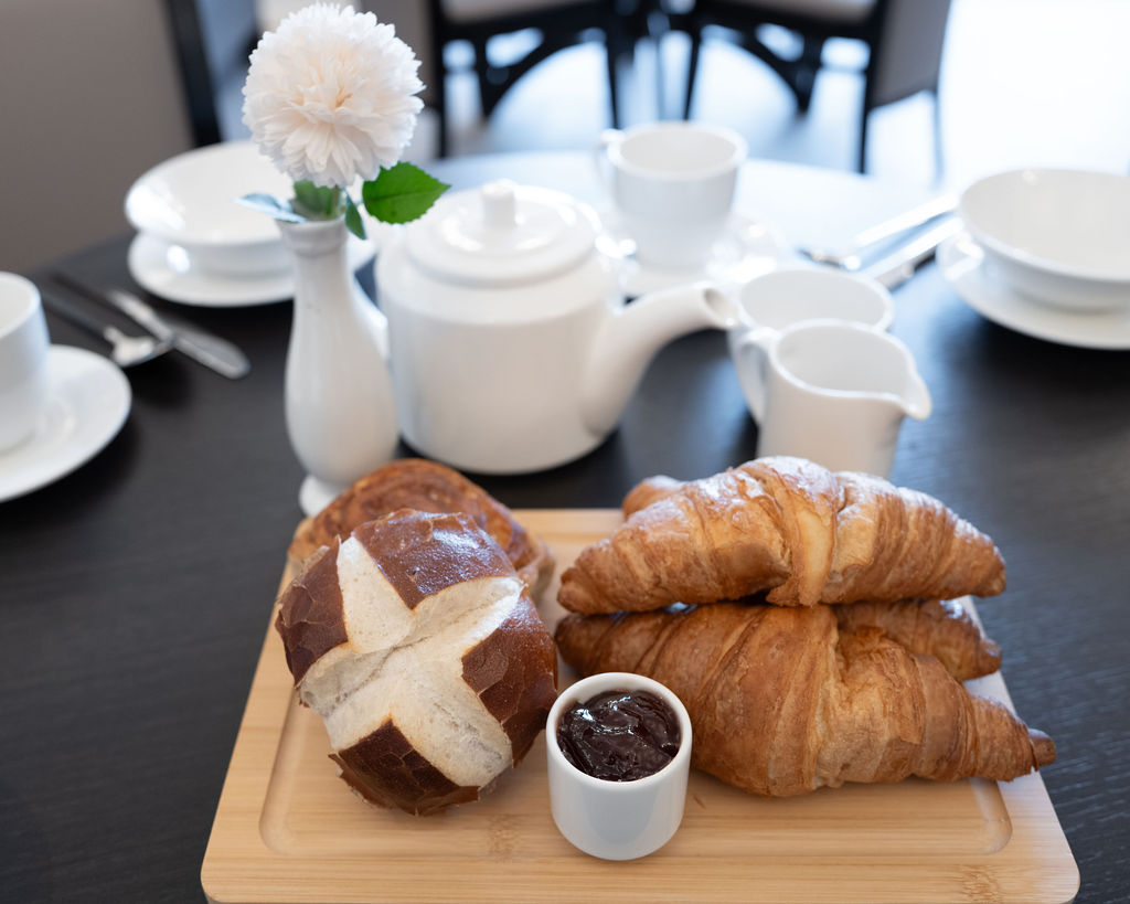 pastries and coffee on a black table