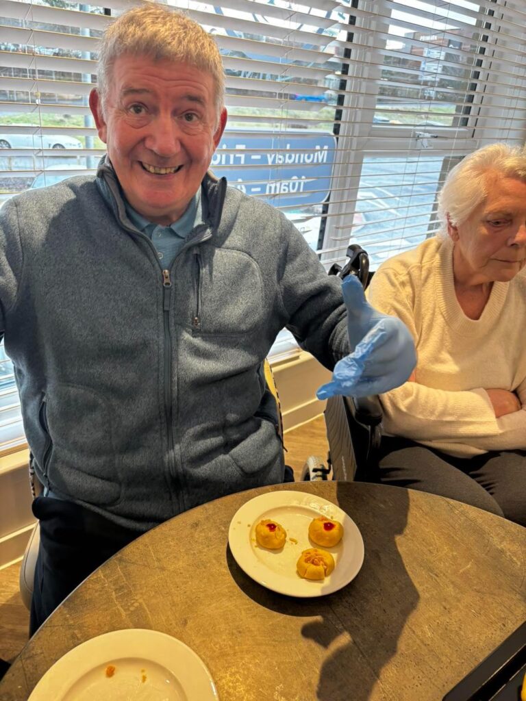 care home resident with cookies