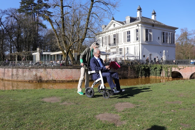 couple outside in wheelchair aids