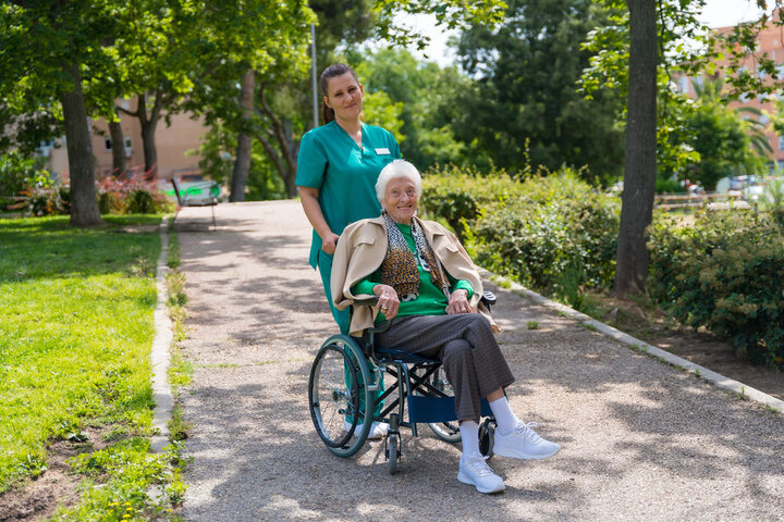 resident with carer in garden