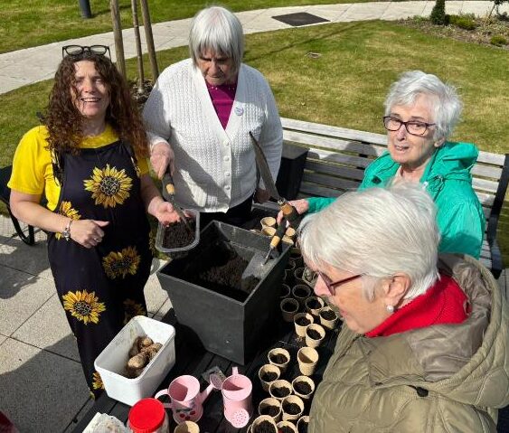 residents gardening at almond valley care home
