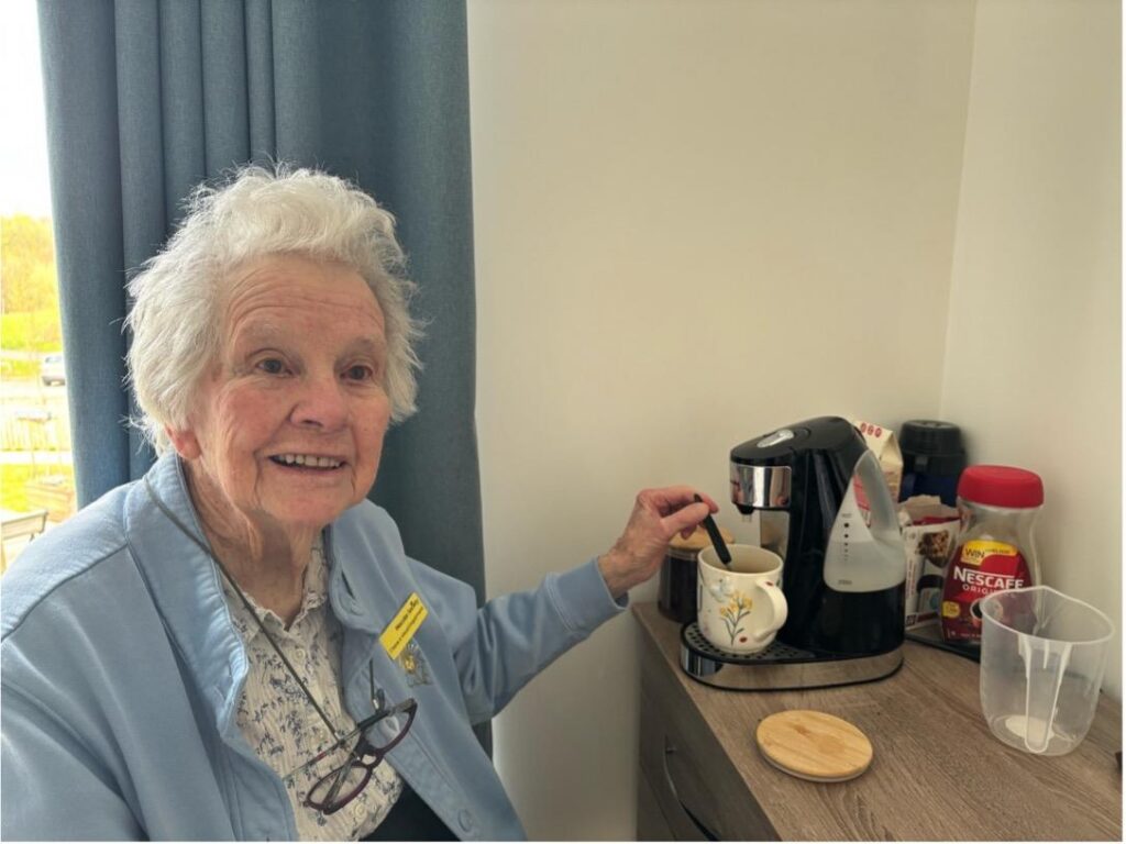 joan with her coffee machine
