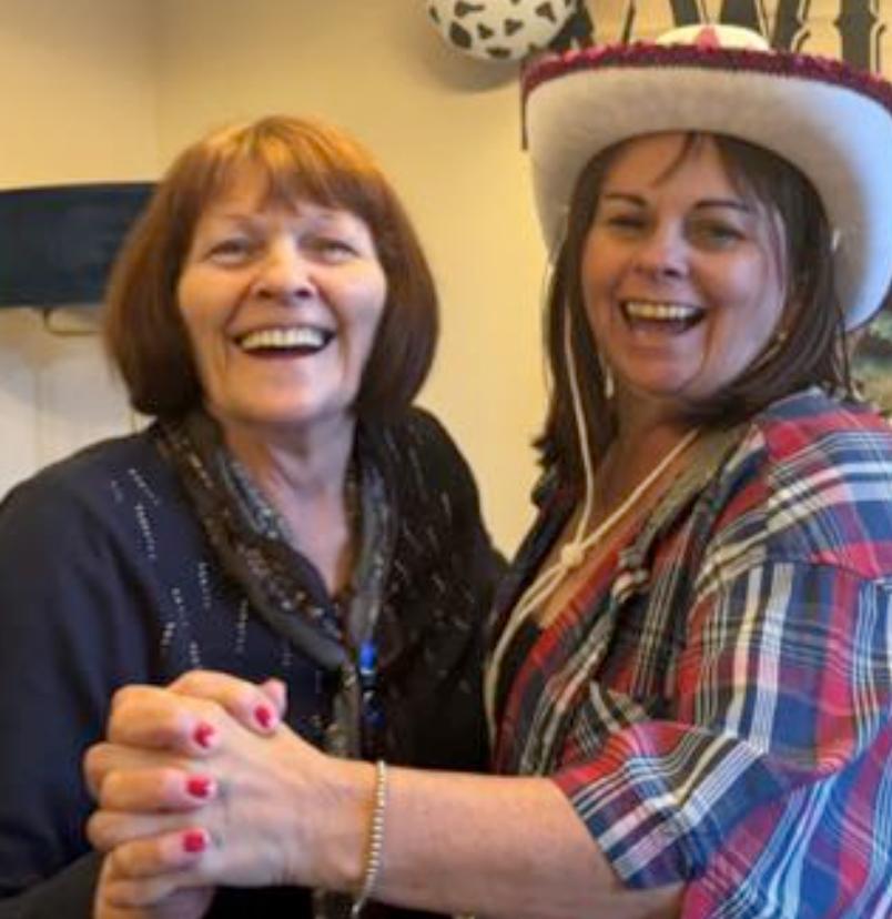 resident dancing and smiling